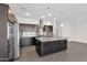 Modern kitchen features dark cabinetry, stainless steel appliances, and granite counters at 3498 E Ravenswood Dr, Gilbert, AZ 85298