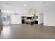 Open living space with tile floors and a view to the kitchen at 3498 E Ravenswood Dr, Gilbert, AZ 85298