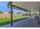 Expansive covered patio area with a putting green, kitchen, and great features at 3498 E Ravenswood Dr, Gilbert, AZ 85298