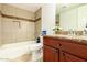 Updated bathroom features decorative tile accents and granite countertops at 3554 W Aire Libre Ave, Phoenix, AZ 85053