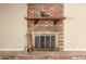 Classic brick fireplace featuring a decorative mantel at 3554 W Aire Libre Ave, Phoenix, AZ 85053