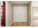 Bright foyer featuring tile flooring and a double-door entrance at 3554 W Aire Libre Ave, Phoenix, AZ 85053