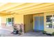 Inviting covered front porch with brick accents at 3554 W Aire Libre Ave, Phoenix, AZ 85053