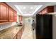 Well-equipped kitchen featuring granite countertops and modern appliances at 3554 W Aire Libre Ave, Phoenix, AZ 85053