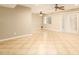 Spacious living room featuring ceiling fans and tile flooring, great for entertaining at 3554 W Aire Libre Ave, Phoenix, AZ 85053