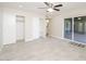 Bedroom features sliding door access to the patio, and closet organizers providing ample storage at 3824 W Carol Ave, Phoenix, AZ 85051