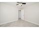 Bedroom featuring a ceiling fan, tiled floor, neutral walls, and open doorway at 3824 W Carol Ave, Phoenix, AZ 85051