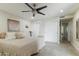 Serene bedroom featuring a comfortable bed, ceiling fan, and ample closet space, offering a relaxing retreat at 3824 W Carol Ave, Phoenix, AZ 85051