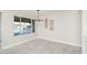 Dining area featuring modern light fixture and view of the backyard pool area at 3824 W Carol Ave, Phoenix, AZ 85051