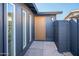 The entryway features a modern door with sidelight windows on a landscaped property at 3824 W Carol Ave, Phoenix, AZ 85051