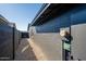 An exterior view shows the property's gravel lined side yard and modern design at 3824 W Carol Ave, Phoenix, AZ 85051