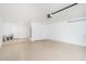 Spacious garage with sealed concrete floor and a new garage door opener at 3824 W Carol Ave, Phoenix, AZ 85051