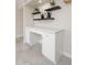 Bright workstation includes drawers and cabinets, and it is beautifully complemented by floating shelves at 3824 W Carol Ave, Phoenix, AZ 85051