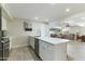 Updated kitchen island featuring a sink, stainless steel dishwasher, and stylish cabinetry at 3824 W Carol Ave, Phoenix, AZ 85051