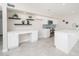 Modern kitchen featuring white cabinets, stainless steel appliances, and a functional center island at 3824 W Carol Ave, Phoenix, AZ 85051