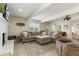 Spacious living room with a fireplace, comfortable seating, and lots of natural light, perfect for Gathering gatherings at 3824 W Carol Ave, Phoenix, AZ 85051