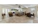 Spacious living room with a fireplace, comfortable seating, and tile flooring, perfect for relaxation at 3824 W Carol Ave, Phoenix, AZ 85051