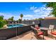 Backyard pool with patio area and seating, perfect for outdoor entertaining and relaxation at 3824 W Carol Ave, Phoenix, AZ 85051