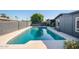 Inviting backyard pool area with lush landscaping and a spacious patio at 3824 W Carol Ave, Phoenix, AZ 85051