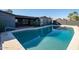 Backyard pool area with a covered patio, perfect for outdoor activities at 3824 W Carol Ave, Phoenix, AZ 85051
