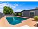 Beautiful in-ground pool and patio area perfect for outdoor entertaining in the well-kept backyard at 3824 W Carol Ave, Phoenix, AZ 85051