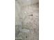 Detailed view of a shower with elegant neutral tile, mosaic accents, and a built-in niche at 3824 W Carol Ave, Phoenix, AZ 85051