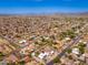 Panoramic aerial shot of a vibrant neighborhood featuring picturesque mountain views and sunny skies at 3951 E Sequoia Trl, Phoenix, AZ 85044