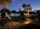 Expansive backyard with playground, lush lawn, trees and a curved low wall at 3951 E Sequoia Trl, Phoenix, AZ 85044