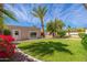 Lush backyard features vibrant bougainvillea and manicured landscaping, offering a private and tranquil retreat at 3951 E Sequoia Trl, Phoenix, AZ 85044