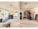 Versatile basement living area with a fireplace, TV, and convenient access to the outdoor patio at 3951 E Sequoia Trl, Phoenix, AZ 85044