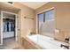 Bright bathroom with a soaking tub, and plenty of natural light at 3951 E Sequoia Trl, Phoenix, AZ 85044