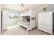 Cozy bedroom with a white bunk bed, closet, ceiling fan, and a bright window at 3951 E Sequoia Trl, Phoenix, AZ 85044