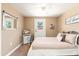 Cozy bedroom featuring a comfortable bed, ample natural light, and a stylish dresser for storage at 3951 E Sequoia Trl, Phoenix, AZ 85044