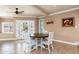 Bright dining area with views of the pool, a round table and white chairs at 3951 E Sequoia Trl, Phoenix, AZ 85044