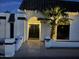 Inviting entrance with arched doorway, wrought iron double doors, and a well-lit exterior at 3951 E Sequoia Trl, Phoenix, AZ 85044