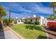 Charming single-story home with well-maintained landscaping and a lush green lawn at 3951 E Sequoia Trl, Phoenix, AZ 85044