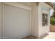 Garage door with a window on the side, offering security and natural light at 3951 E Sequoia Trl, Phoenix, AZ 85044