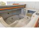 Close-up of a hot tub with multiple jets and a control panel at 3951 E Sequoia Trl, Phoenix, AZ 85044