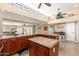 Open-concept kitchen featuring granite countertops and a large island with sink at 3951 E Sequoia Trl, Phoenix, AZ 85044