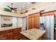 Spacious kitchen featuring granite countertops, stainless steel appliances, and wood cabinetry at 3951 E Sequoia Trl, Phoenix, AZ 85044
