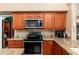 Updated kitchen with stainless steel appliances and granite countertops at 3951 E Sequoia Trl, Phoenix, AZ 85044
