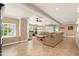 Open-concept living room with tile flooring, windows for natural light, and comfortable seating area at 3951 E Sequoia Trl, Phoenix, AZ 85044