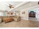 Inviting living room with neutral tones, a comfortable sectional, and tile flooring at 3951 E Sequoia Trl, Phoenix, AZ 85044