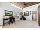 Spacious living area with high ceilings, a ceiling fan, and French doors leading to the backyard at 3951 E Sequoia Trl, Phoenix, AZ 85044