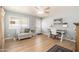Well-lit home office space featuring a comfortable chair and a ceiling fan at 3951 E Sequoia Trl, Phoenix, AZ 85044