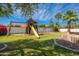 Spacious backyard featuring a wooden play structure, perfect for outdoor fun and Gathering activities at 3951 E Sequoia Trl, Phoenix, AZ 85044