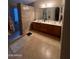 Bathroom with a dual sink vanity and tiled floors at 40724 W Novak Ln, Maricopa, AZ 85138