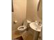 Cozy half bathroom featuring modern fixtures at 40724 W Novak Ln, Maricopa, AZ 85138