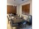 Dining area with a large table and seating for eight at 40724 W Novak Ln, Maricopa, AZ 85138