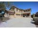 Two-story home featuring a three-car garage and a well-manicured front yard at 40724 W Novak Ln, Maricopa, AZ 85138